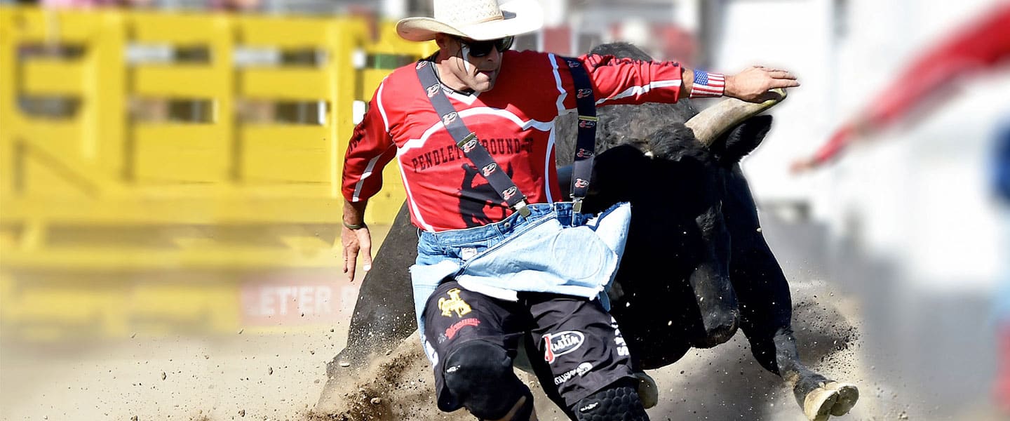 Man being chased by bull